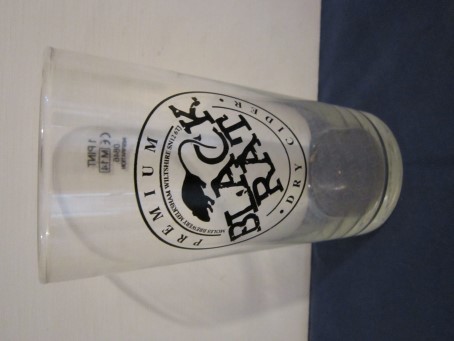 beer glass from the Moles brewery in England with the inscription 'Black Rat Premium Dry Cider, Moles Brewery Melksham Wiltshire SN12 6TJ'