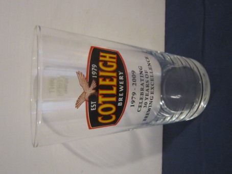 beer glass from the Cotleigh brewery in England with the inscription 'Cotleigh Brewery EST 1979, 1979-2009 Celebrating 30Years Of Brewing Excellence'