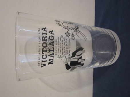 beer glass from the Mahou brewery in Spain with the inscription 'Victoria Malaga Desde 1928'