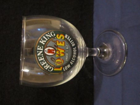 beer glass from the Greene King brewery in England with the inscription 'Greene King Lowes Under 1% Low Alcohol Bitter'