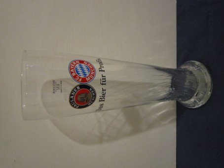 beer glass from the Paulaner brewery in Germany with the inscription 'Paulaner Munchen, FC Bayern Munchen. Das Bier Fur Profis'