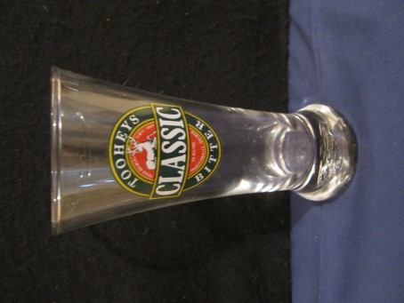 beer glass from the Tooheys  brewery in Australia with the inscription 'Tooheys Classic Bitter Proud Brewers Since1869 5% Alc/Vol Traditionally Brewed'