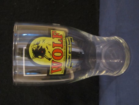 beer glass from the Wolf brewery in England with the inscription 'Wolf Traditional Ale, From The Heart Of Norfolk, Howlin Good Beer'