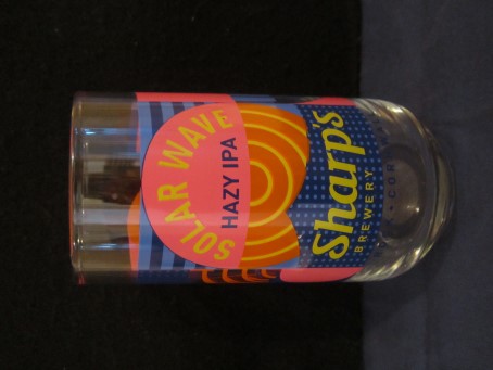 beer glass from the Sharp's brewery in England with the inscription 'Solar Eave Hazy IPA Sharps Brewery, Rock Cornwall'