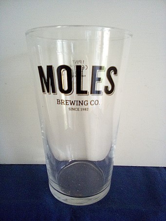 beer glass from the Moles brewery in England with the inscription 'Moles Brewing Co Since 1982'