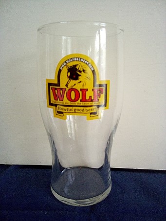 beer glass from the Wolf brewery in England with the inscription 'Wolf Traditional Ale From The Heart Of Norfolk Howlin Good Beer, www.wolfbrewery.com'