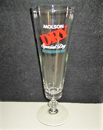 beer glass from the Molson Coors brewery in Canada with the inscription 'Molson Dry Special Day The Evolution Of Beer'