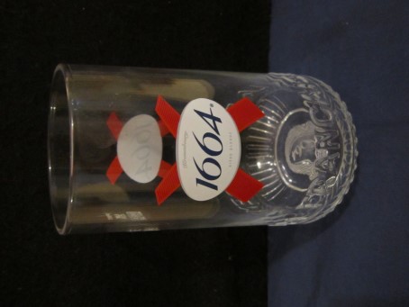 beer glass from the Kronenbourg brewery in France with the inscription 'Kronenbourg 1664 Biere Blond, La Biere Premium Francaise'